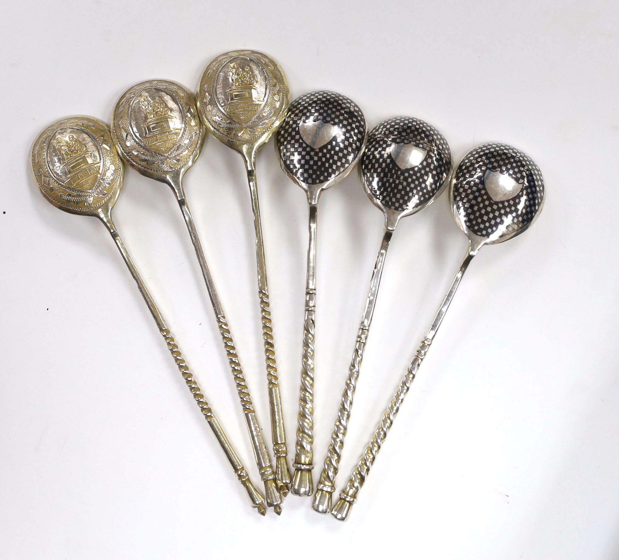 Three 19th century Russian 84 zolotnik and niello teaspoons, 1867 and three similar parcel silver gilt teaspoons, 12.8cm, gross 91 grams.